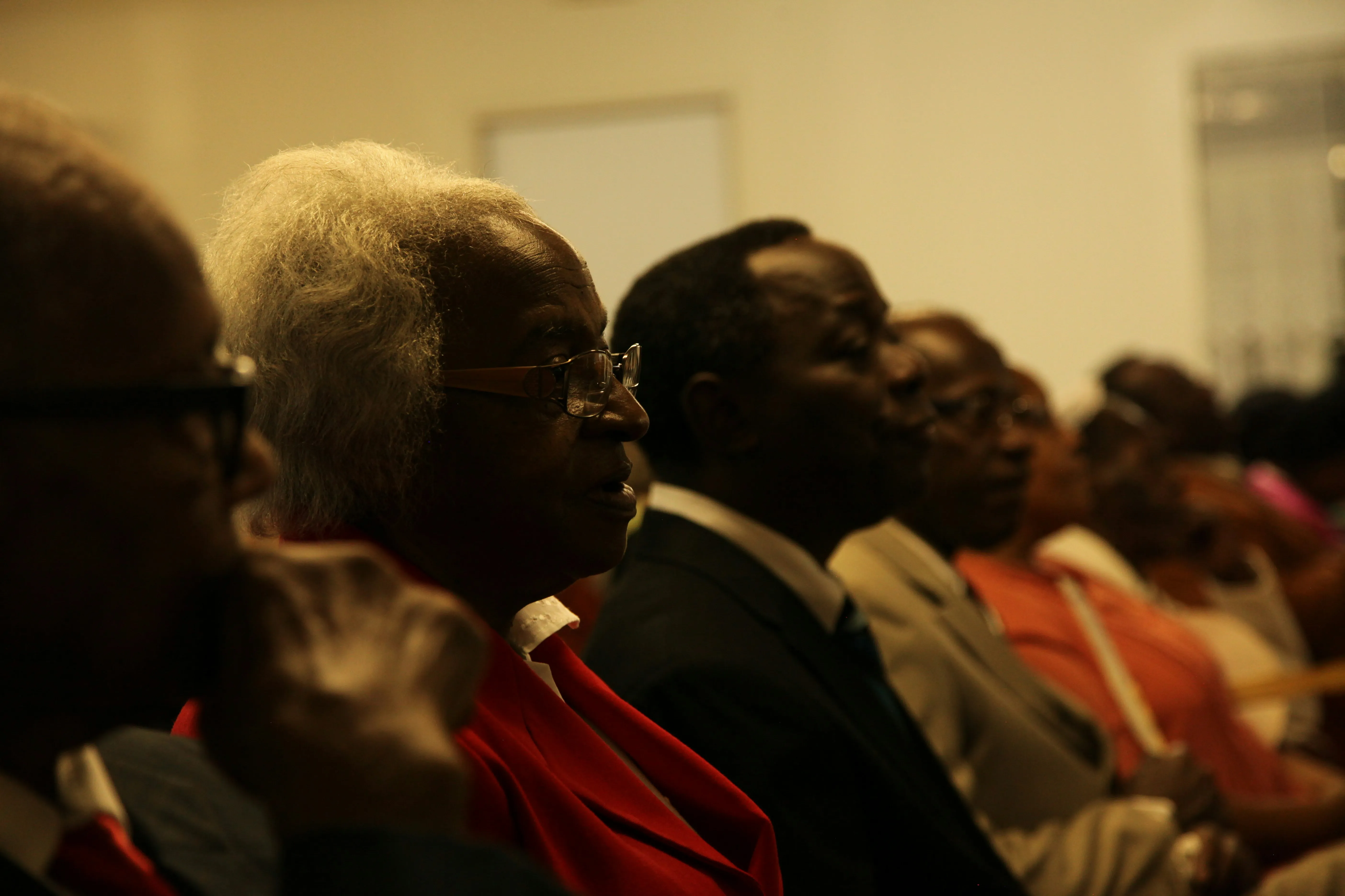 side profile of church members in a row
