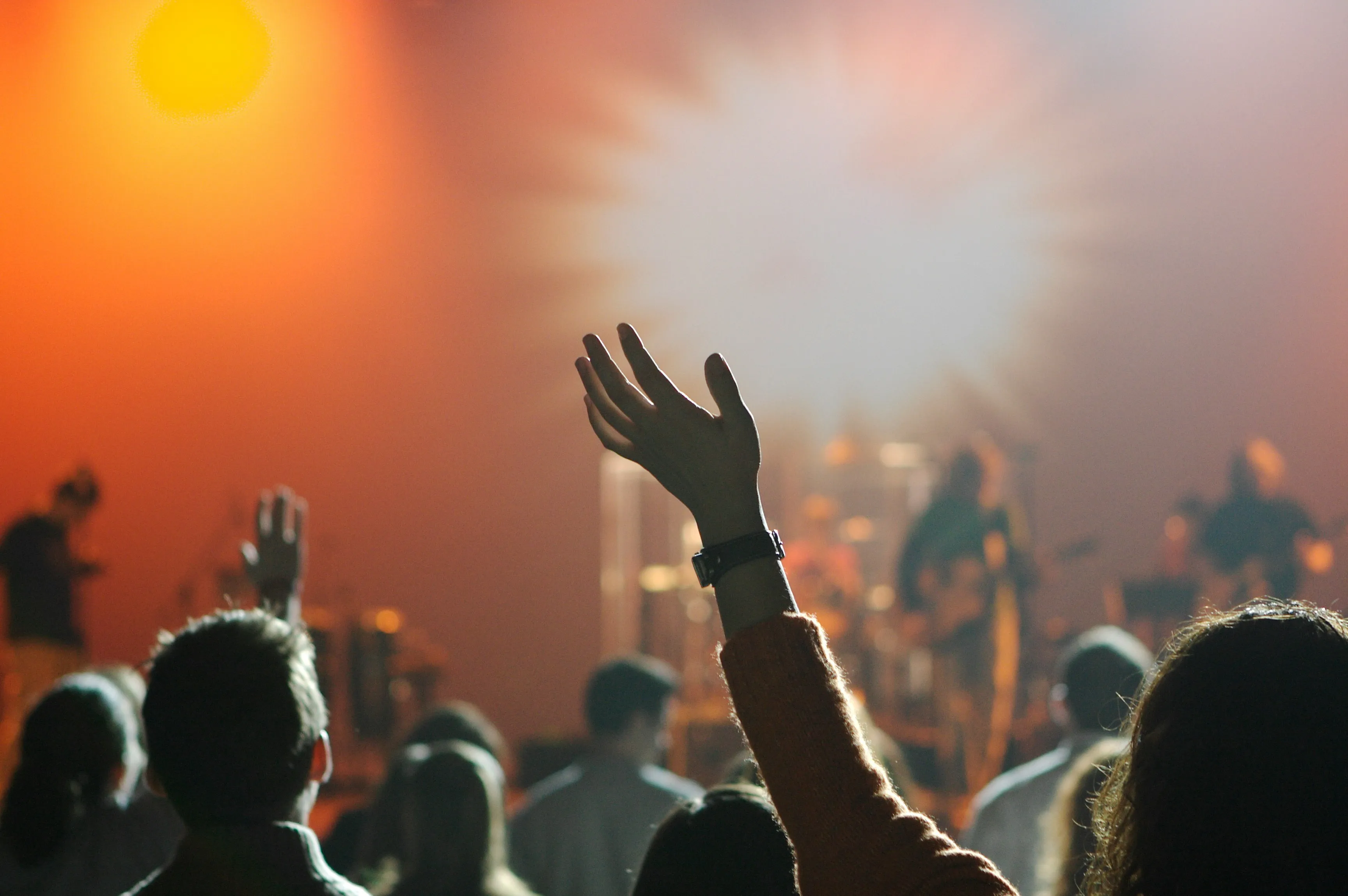Congregration raising hands to worship